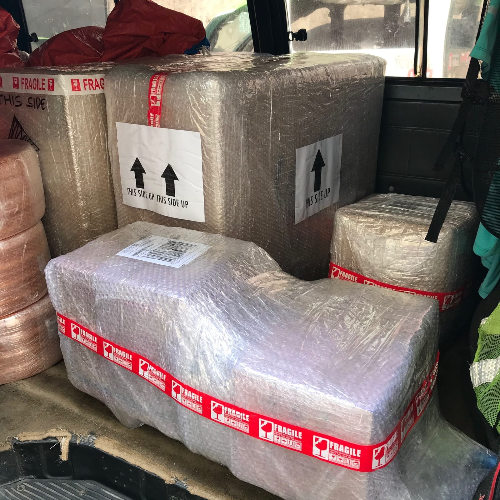 Wrapped and taped MyLoad N Wash units loaded for delivery