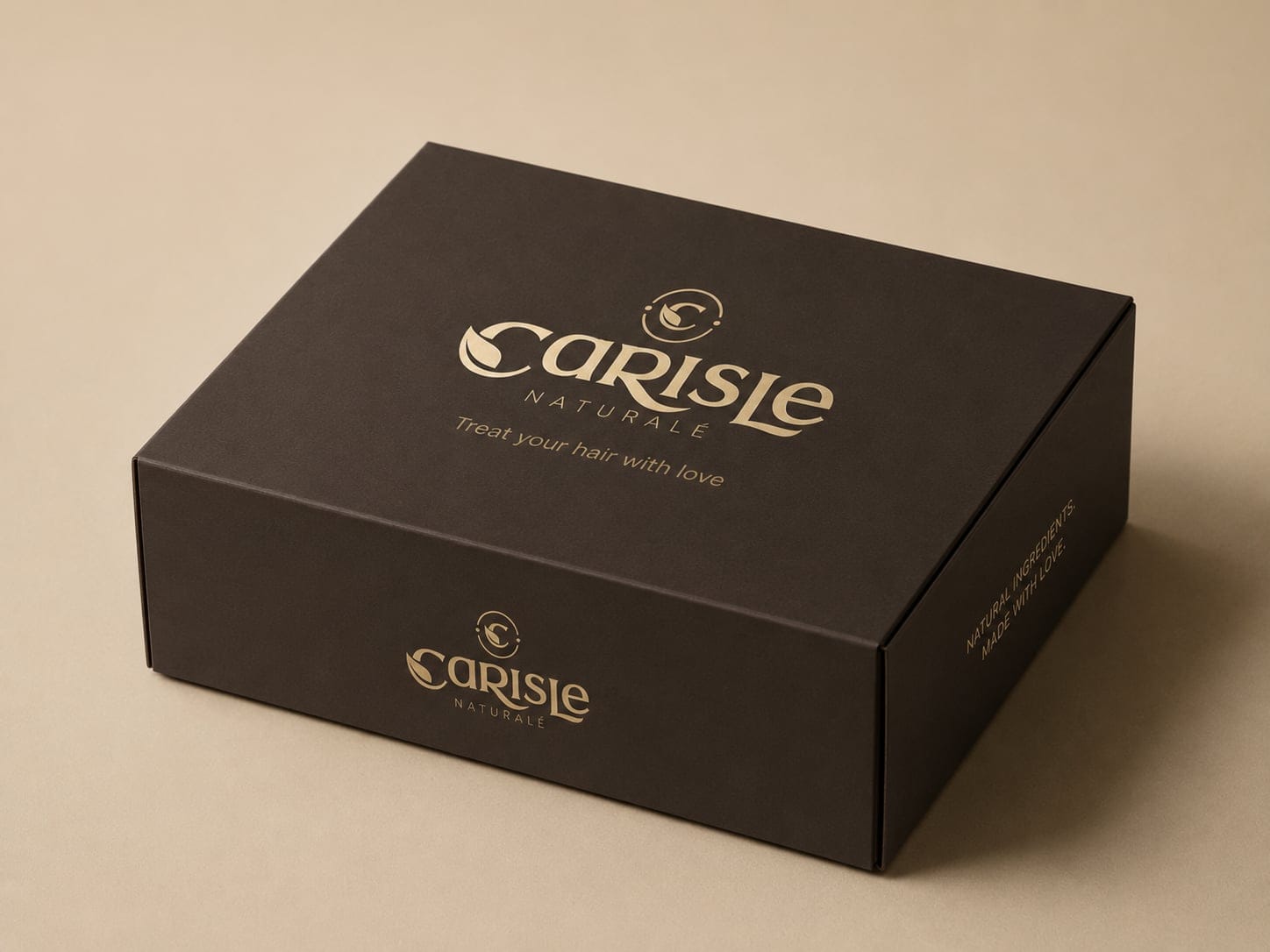 The dark brown Carisle Naturale mailer box, gold-stamped — treat your hair with love