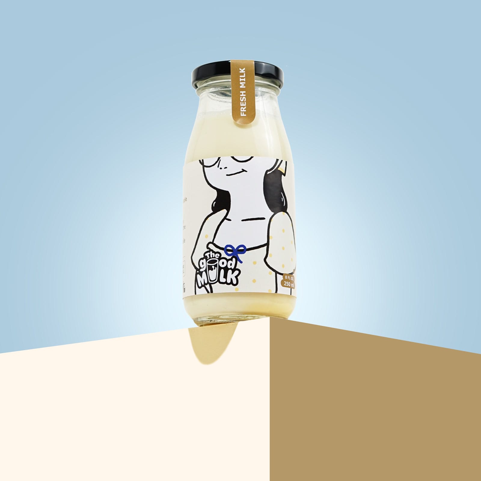 A single Fresh Milk bottle balanced on a cream ledge against a blue backdrop